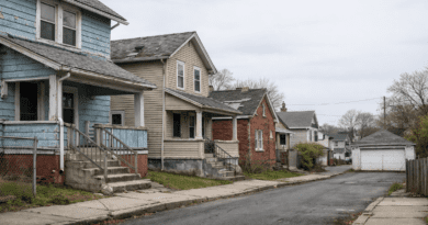 Quiet, abandoned street with houses.